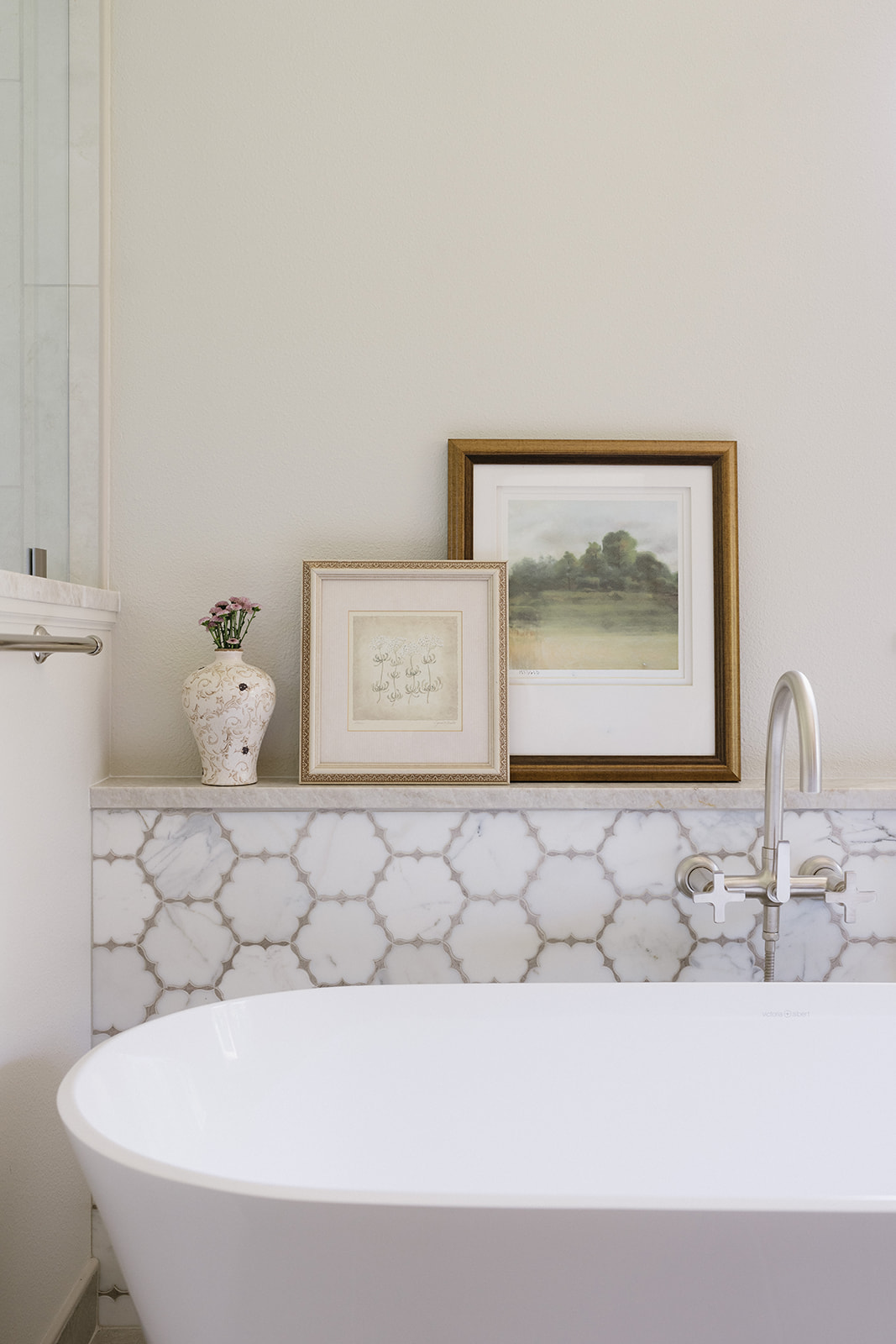 Freestanding tub with marble arabesque backsplash — wray